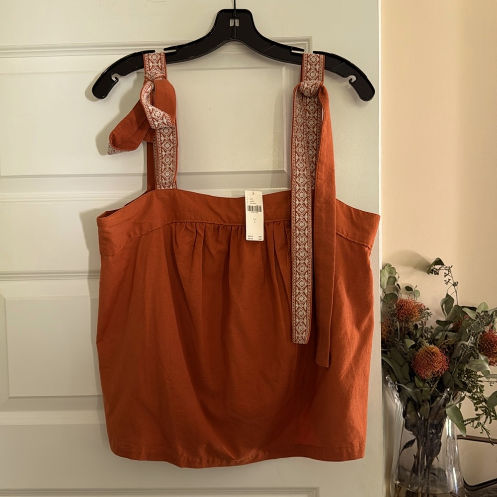 New with tags. By Anthropologie. adorable orange shirt